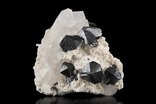 Cassiterite with Quartz and Albite<br />Shengus (Shingus), Distrito Roundu, Gilgit-Baltistan (Áreas del Norte), Paquistán<br />14 x 13.5 x 7.5 cm / main crystal: 3.7 cm.<br /> (Author: MIM Museum)