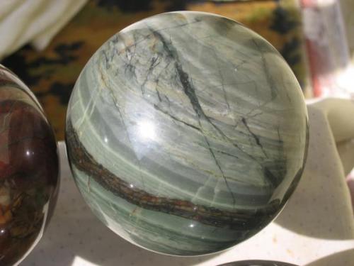 Handmade sphere, 90mm
Quartz chlorite and pyrite (Author: farmukanx)