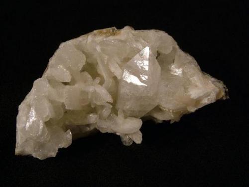 Fluorapophyllite + stilbite + quartz
Creag na Cuail, Duirinish, Isle of Skye, Scotland, UK
Specimen is 8 cm wide x 4 cm x3 cm.
The double terminated apophyllite crystal is 34 mm x 16 mm.

Apohyllite + stilbite + quartz. The double terminated apophyllite crystal is 34mm x 16mm. The specimen is 8cm wide x 4cm x3cm. Self-collected 1995 from Sgurr nam Boc, Isle of Skye. (Author: Mike Wood)