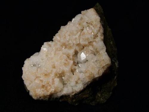 Chabazite on analcime
Talisker Bay, Isle of Skye, Scotland, UK 
Specimen is 8 cm wide x 6 cm high x 5 cm deep
Chabazite crystals to 8 mm

Attractive combination of pinkish simple chabazite crystals to 8mm on translucent analcime crystals. Specimen is 8cm wide x 6cm high x 5cm deep. Self-collected 1990 from Talisker Bay, Isle of Skye. (Author: Mike Wood)