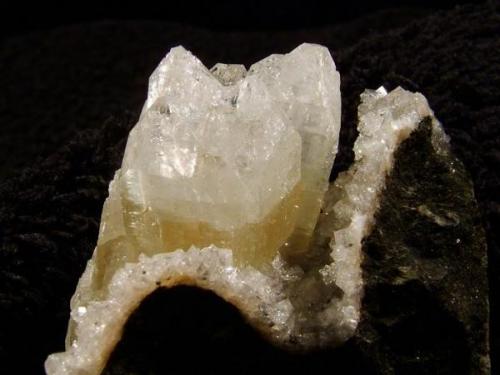 Apophyllite + Chabazite. This is the same specimen as Skye Minerals 091 seen previously, but after trimming, so this view is from the other side. Happily the trimming worked well ! The apophyllite crystal group is 22mm wide and 20mm long, on this side. Self-collected 2004 from Creag na Cuail, Duirinish, Isle of Skye. (Author: Mike Wood)