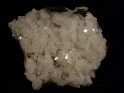 Chabazite. A nice plate of lustrous white chabazite crystals to 10mm. Specimen measures 8cm x 7cm. Self-collected 1993 from Talisker Bay, Isle of Skye, Scotland. (Author: Mike Wood)