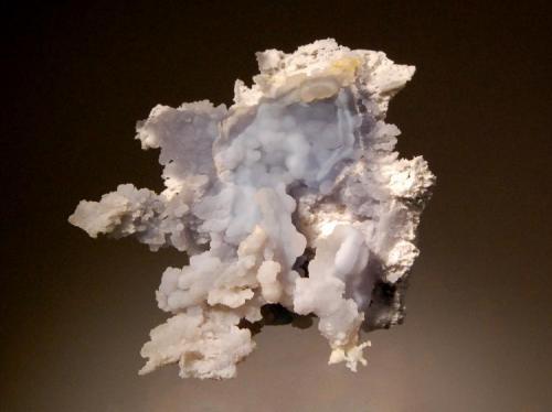 Chalcedony
Mogila deposit, Septemvri Mine, Madan District, Bulgaria
5.5 x 6.7 cm.
Pale blue botryoidal chalcedony on a white silicified boxwork matrix. An unusual occurence at this location. (Author: crosstimber)