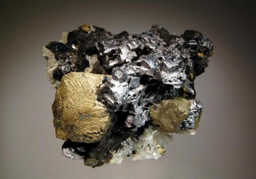 Chalcopyrite
Mogila deposit, Septemvri Mine, Madan District, Bulgaria
7.7 x 8.4 cm.
Chalcopyrite with quartz, sphalerite, and galena with a partially "melted" look. (Author: crosstimber)