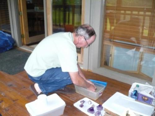 Terry washing some crystals at his cabin. (Author: John S. White)