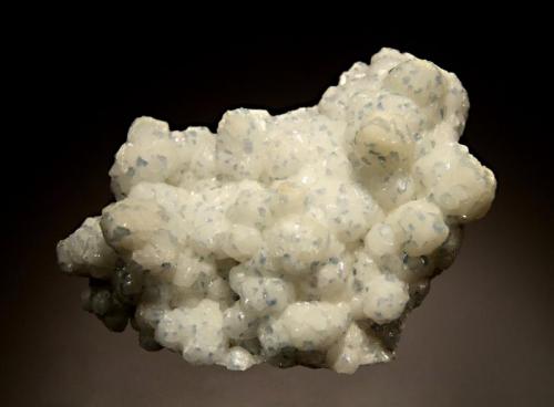 Celestine
Mojina Mine, Mun. de Buenaventura, Chihuahua, Mexico
6.1 x 8.0 cm.
Botryoidal white calcite studded with small blue crystals of celestine. (Author: crosstimber)