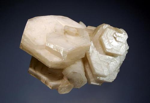 Calcite
Charcas, San Luis Potosi, Mexico
5.2 x 7.0 cm.
A cluster of lustrous, hexagonal white calcite crystals with the classic ‘poker chip’ habit. (Author: crosstimber)