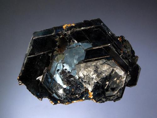 Hematite
Ouro Preto,  Minas Gerais, Brazil
5.0 x 7.5 cm
Lustrous black hexagonal crystals to 3 cm on edge arranged in a classic 
“eisenrose” shape. (Author: crosstimber)
