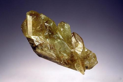 Chrysoberyl
Colatina, Espirito Santo, Brazil
2.0 x 4.0 cm.
Lustrous yellow-green to brown crystal group showing cyclic twinning. (Author: crosstimber)