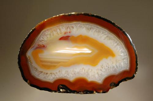 Chalcedony var. agate
Rio Grande do Sul, Brazil
7.0 x 12.0 cm.
A colorful example of a Brazilian agate. (Author: crosstimber)