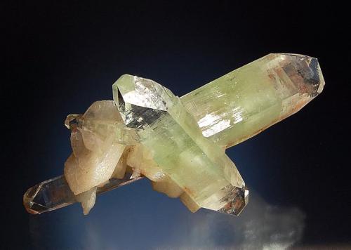 Fluorapophyllite-(K)
Ahmednagar District, Maharashtra, India
5.0 x 9.5 cm.
An intersecting group of apophyllite crystals to 5.2 cm with pale tan stilbite crystals. (Author: crosstimber)