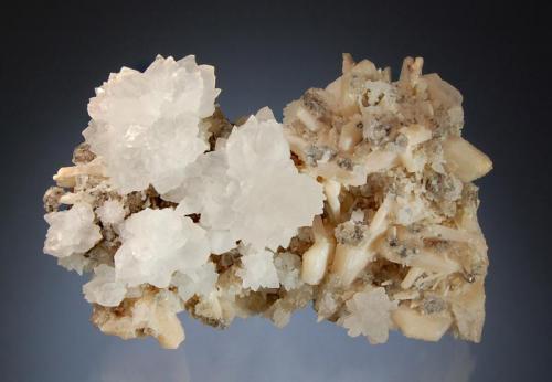 Calcite
Panvel, Raigad District, Maharashtra, India
7.1 x 11.0 cm.
Colorless groups of scalenohedral calcite to 3.5 cm on pale peach stilbite and quartz. (Author: crosstimber)