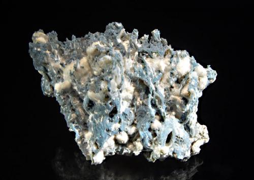 Chalcedony
Aurangabad quarries, Maharashtra, India
7.2 x 9.0 cm.
Thin strings of blue chalcedony interspersed with cottony white mordenite. (Author: crosstimber)