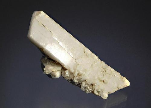 Microcline
Raikot, Chilas Diamer District, Gilgit-Baltistan, Pakistan
3.6 x 8.0 cm.
Porcelain white Baveno-twinned microcline crystal with numerous smaller crystals along one prism face. (Author: crosstimber)