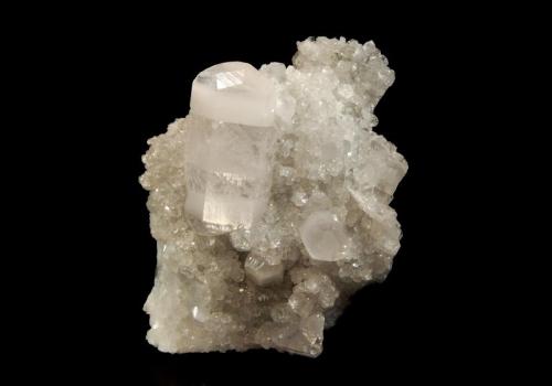 Calcite
Fozichong Mine, Cenxi Co., Wuzhou Pref., Guangxi Zhuang AR, China
6.1 x 7.2 cm
Doubly-terminated, colorless , barrel-shaped calcite crystal with opaque white zones at the terminal ends on a matrix of smaller calcite crystals. (Author: crosstimber)