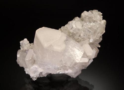 Calcite
Fozichong Mine, Cenxi Co., Wuzhou Pref., Guangxi Zhuang AR, China
4.2 x 6.7 cm.
Colorless prismatic calcite crystals with opaque white zones at the terminal ends on a matrix of smaller calcite crystals. (Author: crosstimber)