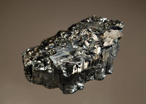 Bournonite
Yaogangxian Mine, Yizhang Co., Chenzhou Pref., Hunan Prov., China
4.0 x 5.2 cm
A single floater of bright metallic bournonite with minor quartz. (Author: crosstimber)