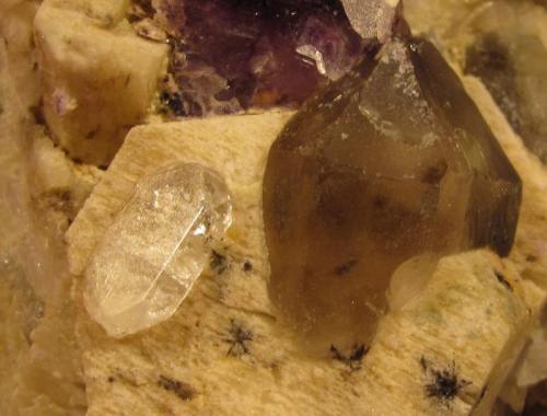 Fluorite, Topaz, Microcline, Smoky Quartz, Albite.
Lundy Island, Devon, England, UK
60mm x 58mm x 21mm
More magnified view of the above specimen. Topaz crystal 8 x 4mm and approx. 2mm thick.
All these collected from a sea-level locality on the island, several years ago. (Author: Mike Wood)