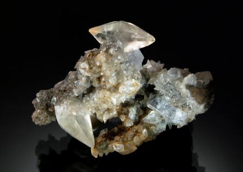 Calcite
Rt. 13 roadcut, Chittenango Falls, Madison Co., New York
4.5 x 5.2 cm
Scalenohedral calcite crystals to 1.5 cm on limestone matrix with bladed pale blue celestite. (Author: crosstimber)