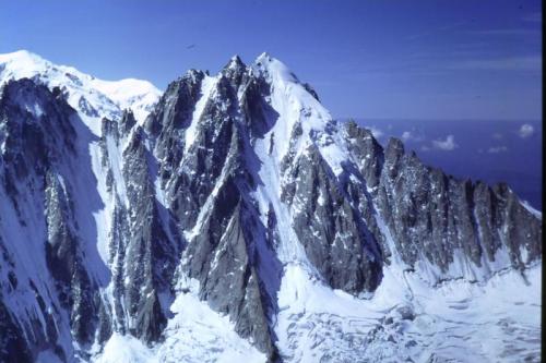 L’Aiguille Verte (4122m) north face, seen across Glacier D’ Argentière from the summit of Le Aiguille D’ Argentière (3999m).
les Droites is to the left, even more impressive a sight.
Photo taken 1992. Scanned from slide. (Author: Mike Wood)