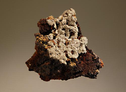 Chlorargyrite
Broken Hill mines, Broken Hill, Yancowinna Co., New South Wales, Australia
4.5 x 5.0 cm
Rich crystalline gray chlorargyrite covering the top of a brown gossan matrix. (Author: crosstimber)