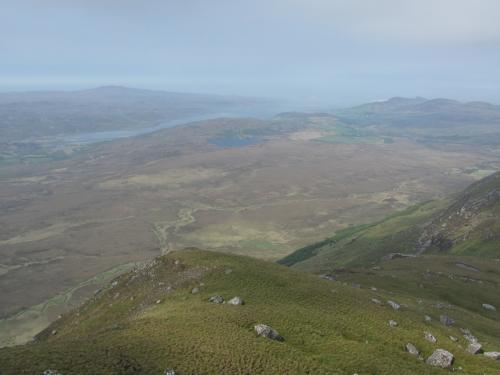 Ben Loyal, Sutherland, Scotland
The mist cleared briefly and afforded a view looking west towards my wild campsite, just the other side of the small loch (lake) which is on the nearside of the sea-inlet, which is called the ’Kyle of Tongue’. (Author: Mike Wood)