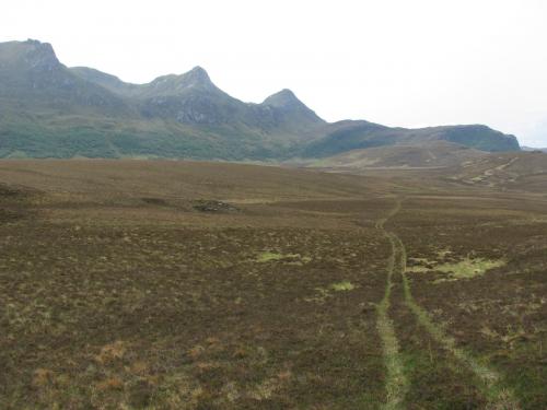 Ben Loyal, Sutherland, Scotland
I walked from the tent towards the mountain across the heathery moorland and bog. There was a farmer’s quad bike track to follow in places which made things easier. (Author: Mike Wood)