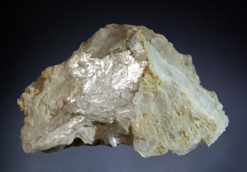Brucite
Wood’s Chrome Mine, Texas, Lancaster Co., Pennysylvania, USA
6.6 x 10.4 cm
Triangular plate of colorless brucite with a laminated structure and pearlescent luster. (Author: crosstimber)