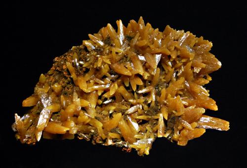 Butterscotch-colored pyramidal crystals to 1.5 cm. on a brown limonitic matrix. (Author: crosstimber)