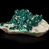 Dioptase on CalciteMina Tsumeb, Tsumeb, Región Otjikoto, Namibia26,0	x	13,0	x	12,5	cm (Author: MIM Museum)