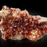 Vanadinite on BariteMibladen (distrito minero Mibladen), Midelt, Provincia Midelt, Región Drâa-Tafilalet, Marruecos25,0	x	17,0	x	10,0	cm (Author: MIM Museum)