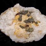 Marcasite on Dolomite on QuartzZona Harrodsburg, Clear Creek, Condado Monroe, Indiana, USAThe geode is 7.5 cm.   The marcasite groupings are about 1.0 cm - 2.4 cm (Author: Bob Harman)