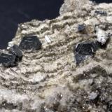 Hematites, Rutilo<br />Monte Cervandone, Alpe Devero, Baceno, Valle Ossola, Provincia Verbano-Cusio-Ossola, Piamonte (Piemonte), Italia<br />108 x 94 mm<br /> (Autor: Sante Celiberti)