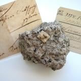 Black ilmenite inclusions (labelled as "kibdelophane") in sanidinite from Laacher See volcano, Niedermendig, Eifel mtns., Rhineland-Palatinate. 6 cm sample. (Author: Andreas Gerstenberg)