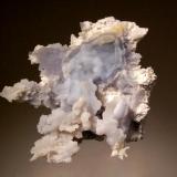 Chalcedony
Mogila deposit, Septemvri Mine, Madan District, Bulgaria
5.5 x 6.7 cm.
Pale blue botryoidal chalcedony on a white silicified boxwork matrix. An unusual occurence at this location. (Author: crosstimber)