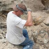 Terry with amethyst piece just recovered, covered by mud. (Author: John S. White)