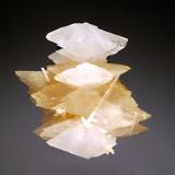 Calcite
Verchniy Mine, Dal&rsquo;negorsk, Primorskiy Kray, Russia
4.1 x 4.6 cm.
Two generations of scalenohedral calcites ranging in color from honey-colored to colorless, with rod-shaped crystals of milky-white aragonite. (Author: crosstimber)