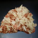 Calcite
Mirzapur, Gangapur District, Maharashtra, India
8.1 x 10.9 cm.
Sharp calcite scalenohedrons to 2.5 cm with bladed, white stilbite crystals on drusy pink heulandite. Collected in 2006. (Author: crosstimber)