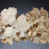 Calcite
Panvel, Raigad District, Maharashtra, India
7.1 x 11.0 cm.
Colorless groups of scalenohedral calcite to 3.5 cm on pale peach stilbite and quartz. (Author: crosstimber)