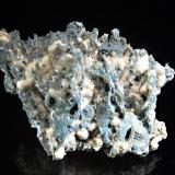 Chalcedony
Aurangabad quarries, Maharashtra, India
7.2 x 9.0 cm.
Thin strings of blue chalcedony interspersed with cottony white mordenite. (Author: crosstimber)