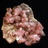 Calcite
Agoudal Mines, Agoudal, Bou Azzer, Tazenakht, Ouarzazate Province, Morocco
6.9 x 7.7 cm.
Pink crystals of cobaltian calcite with nailhead terminations covering the top surface of a thin matrix plate. (Author: crosstimber)