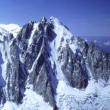 L’Aiguille Verte (4122m) north face, seen across Glacier D’ Argentière from the summit of Le Aiguille D’ Argentière (3999m).
les Droites is to the left, even more impressive a sight.
Photo taken 1992. Scanned from slide. (Author: Mike Wood)